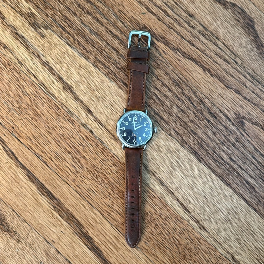 Men’s Shinola runwell watch with brown strap. Needs new battery.
